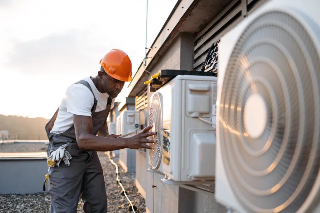 male installing cooling system