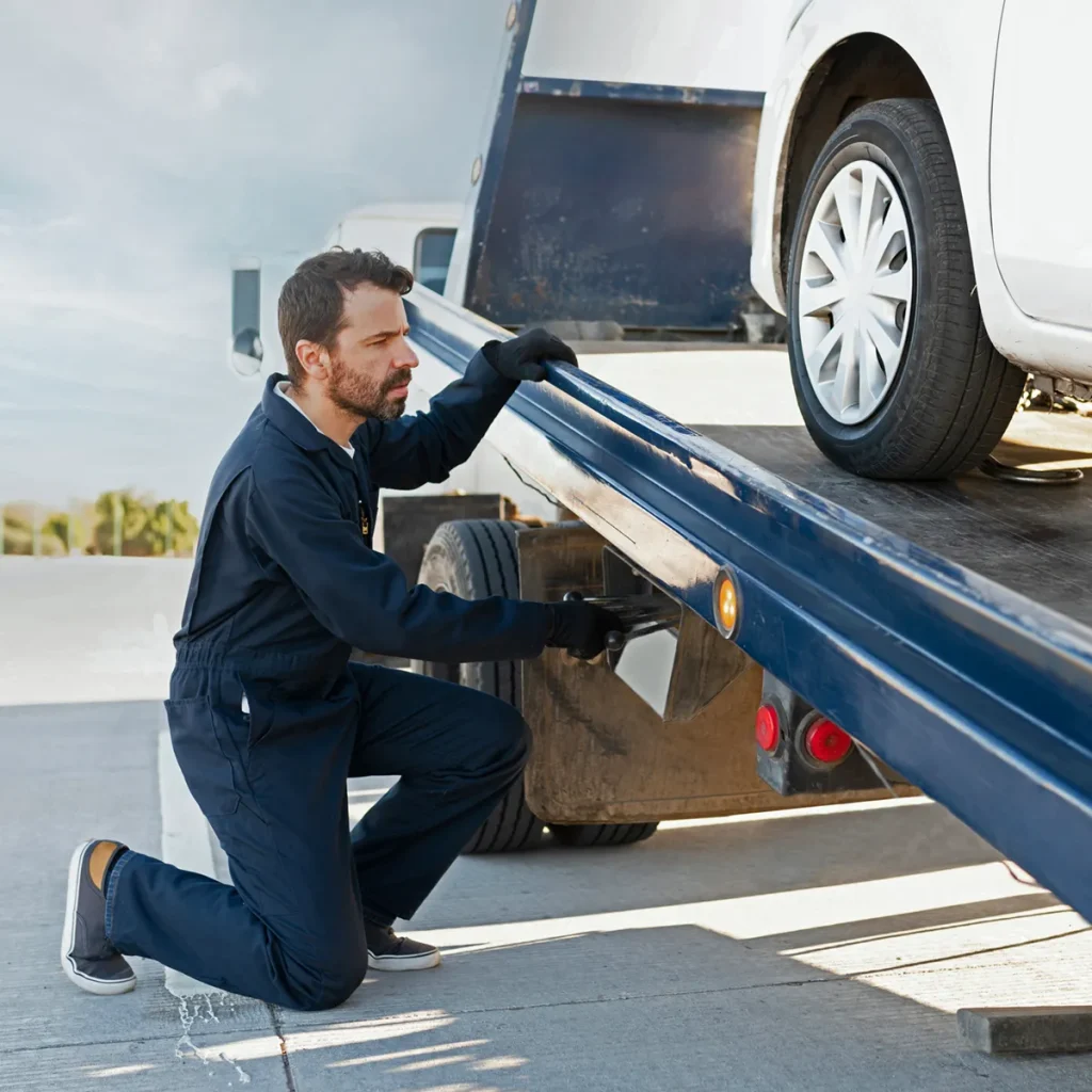 operator raising the tow truck platform
